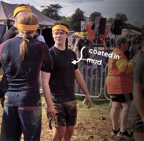 Josh during tough mudder, coated in mud